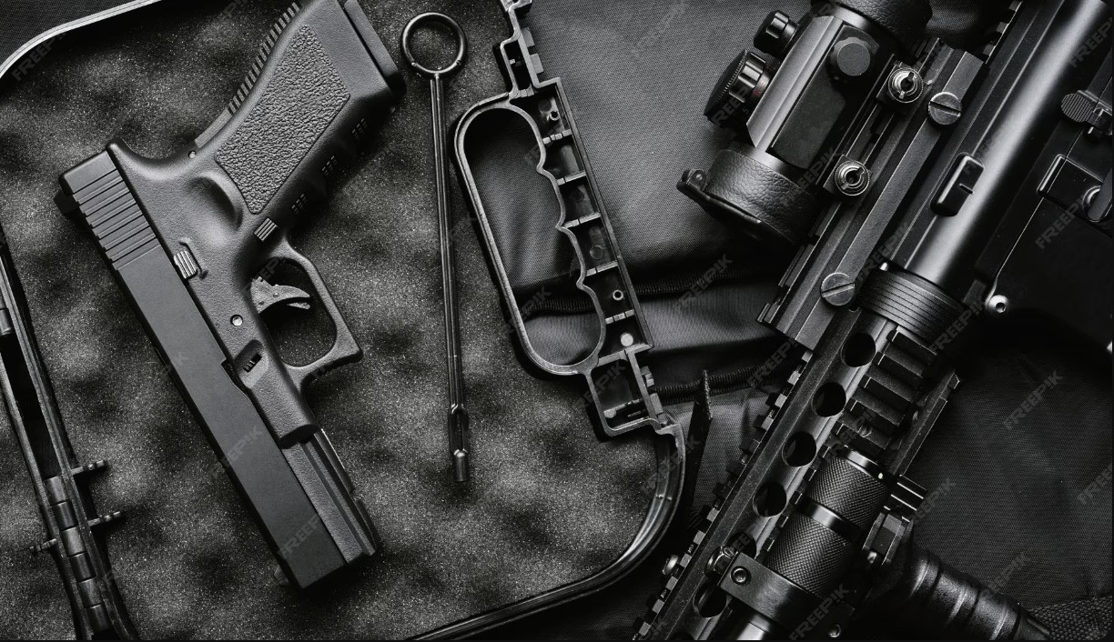 A collection of assault rifles mounted on a wall.
